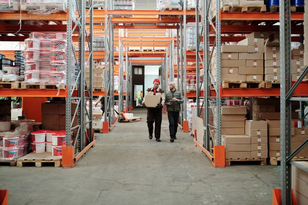 Navisphere Logistics warehouse team moving a shipment